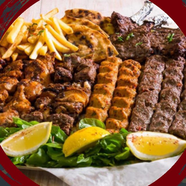 Tandoor Magic mixed grill on a sizzling platter